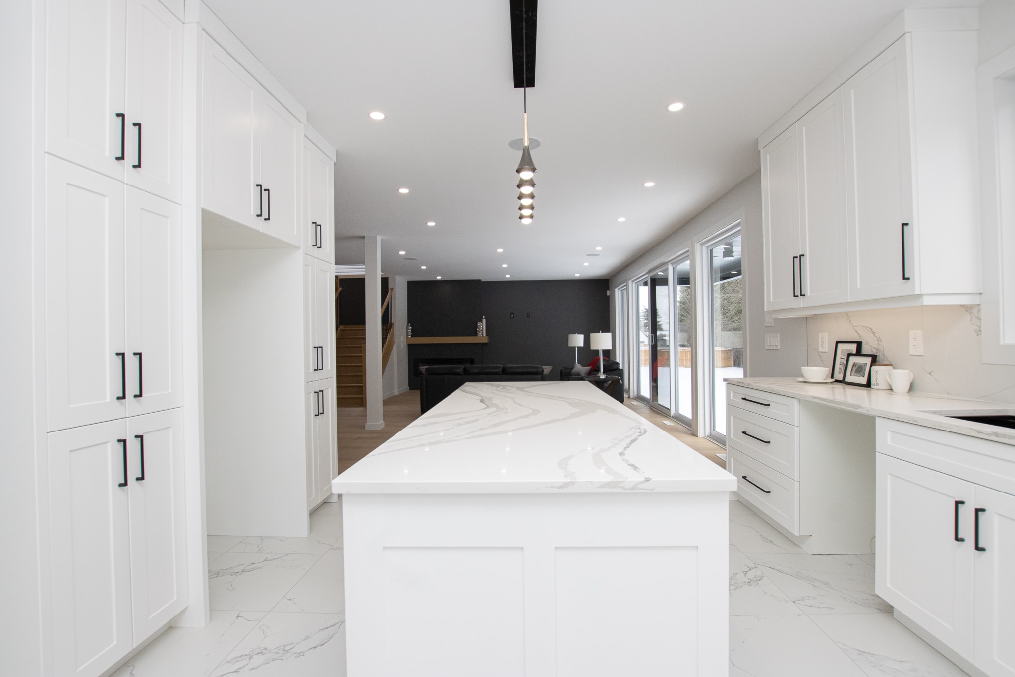 Open hallway with staircase and feature wall